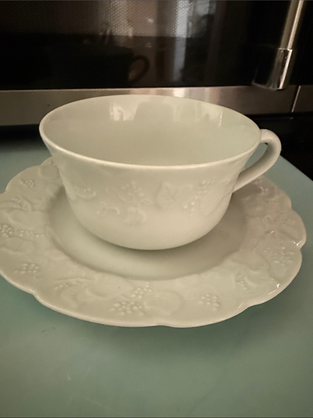 Dansk White Embossed Porcelain Teacup and Saucer